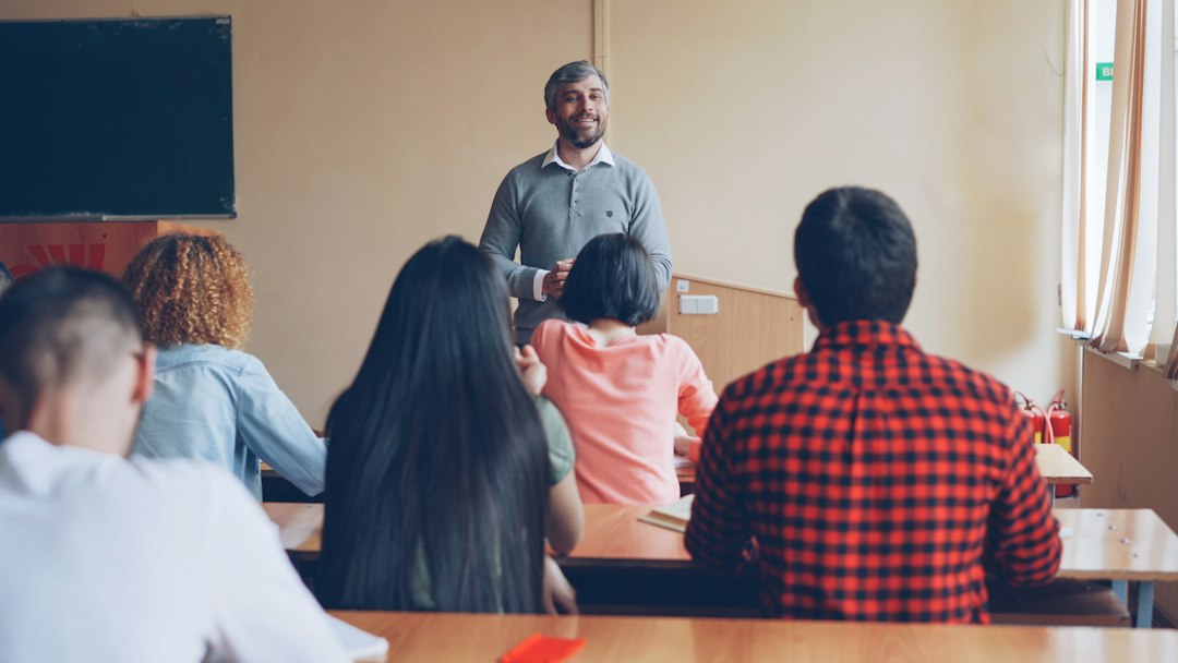 Educator working with students in a classroom