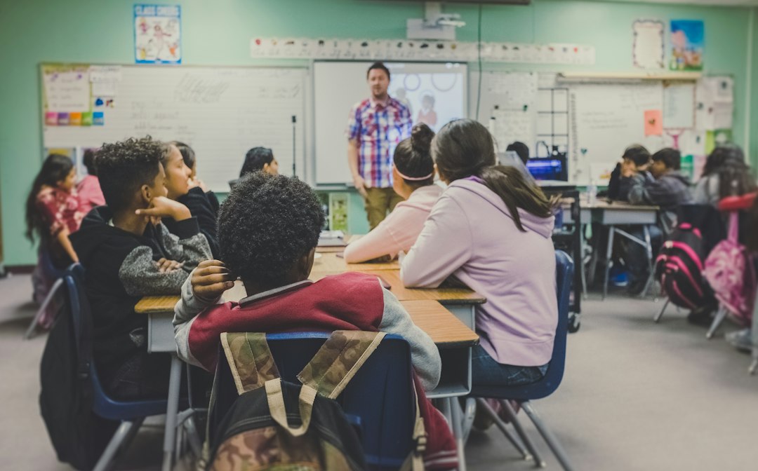 Teacher working with students in a classroom